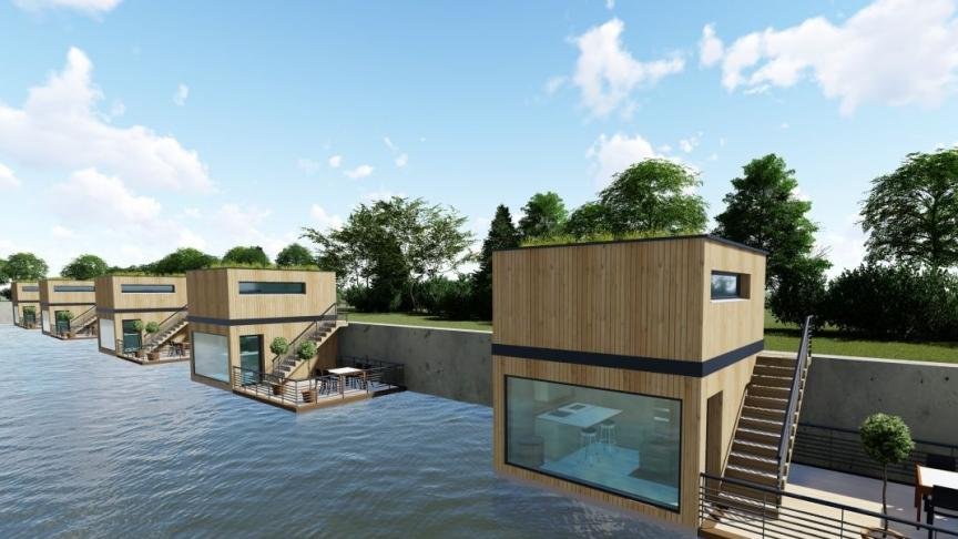 Perspective de maisons à ossature apparente et façades en bois au bord de l’eau
